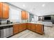 Open kitchen features granite countertops and stainless steel appliances at 6955 Sunrise Crest Dr, Las Vegas, NV 89142