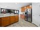 Spacious kitchen with an island and stainless steel refrigerator at 6955 Sunrise Crest Dr, Las Vegas, NV 89142