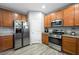 Modern kitchen with stainless steel appliances and wood cabinets at 6955 Sunrise Crest Dr, Las Vegas, NV 89142