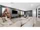Spacious living room with a large sectional sofa and dining area at 6955 Sunrise Crest Dr, Las Vegas, NV 89142
