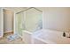 Spa-like bathroom with soaking tub and walk-in shower at 766 Topocoba St, Las Vegas, NV 89178