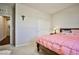 Bedroom with a queen bed and double door closet at 766 Topocoba St, Las Vegas, NV 89178