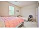 Bedroom with a queen bed, a twin bed, and an office chair at 766 Topocoba St, Las Vegas, NV 89178