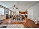 Open dining area featuring hardwood-style floors, ample natural light, and views of the kitchen at 766 Topocoba St, Las Vegas, NV 89178