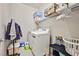 Well-lit laundry room with washer, dryer, and storage at 766 Topocoba St, Las Vegas, NV 89178