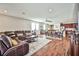 Open living space with sectional sofa, hardwood floors, and access to patio at 766 Topocoba St, Las Vegas, NV 89178
