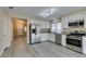 Modern kitchen with stainless steel appliances and granite countertops at 8190 Sandy Creek Dr, Las Vegas, NV 89123