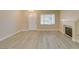 Bright living room with fireplace and laminate flooring at 8190 Sandy Creek Dr, Las Vegas, NV 89123