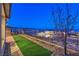 Landscaped backyard with artificial turf and a view of the surrounding community at 92 Stone Bluff Ln, Henderson, NV 89011