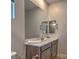 Vanity with large mirror and view into shower at 92 Stone Bluff Ln, Henderson, NV 89011