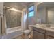 Bathroom with shower/tub combo and modern vanity at 92 Stone Bluff Ln, Henderson, NV 89011