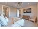 Spacious bedroom with large TV and comfortable seating at 92 Stone Bluff Ln, Henderson, NV 89011