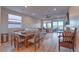 Dining area with wood table and chairs, open to the living room at 92 Stone Bluff Ln, Henderson, NV 89011