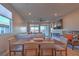 Bright dining area with wooden table and seating for six, offering mountain views at 92 Stone Bluff Ln, Henderson, NV 89011