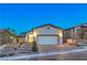 Modern single-story home with attached garage and landscaping at 92 Stone Bluff Ln, Henderson, NV 89011