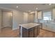 Modern kitchen with island and dark brown cabinetry at 92 Stone Bluff Ln, Henderson, NV 89011