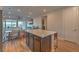 Open concept kitchen with island, dining area, and living room view at 92 Stone Bluff Ln, Henderson, NV 89011