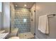 Walk-in shower with geometric tile and built-in seat at 92 Stone Bluff Ln, Henderson, NV 89011