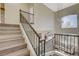 Upstairs hall with a modern railing and a view of the living room below at 9309 Deer Lodge Ln, Las Vegas, NV 89129