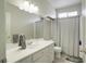 Clean bathroom with white vanity and shower/tub combo at 10605 Moon Flower Arbor Pl, Las Vegas, NV 89144