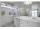 Bathroom with double vanity, large shower, and built-in shelving at 10605 Moon Flower Arbor Pl, Las Vegas, NV 89144