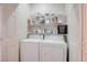 Laundry room with washer, dryer, and shelving at 10605 Moon Flower Arbor Pl, Las Vegas, NV 89144