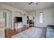 Spacious living room featuring hardwood floors and a cozy fireplace at 10605 Moon Flower Arbor Pl, Las Vegas, NV 89144