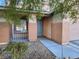 Front entry with blue door and walkway at 11193 Falesco Ave, Las Vegas, NV 89138