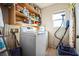 Laundry room with washer, dryer, and shelving at 11193 Falesco Ave, Las Vegas, NV 89138