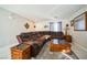 Living room features a sectional sofa and tile floors at 11193 Falesco Ave, Las Vegas, NV 89138