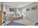 Bright living room with large window and comfy couch at 11193 Falesco Ave, Las Vegas, NV 89138