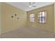 Bedroom with light walls, wood-look floors, and two windows at 1647 Fieldbrook St, Henderson, NV 89052