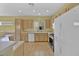 Bright kitchen with light wood cabinets, stainless steel appliances, and tile floor at 1647 Fieldbrook St, Henderson, NV 89052