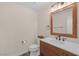 Simple yet elegant bathroom with rustic vanity and modern fixtures at 179 Andada Dr, Henderson, NV 89012