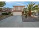 Two-story house with attached garage and nicely landscaped yard at 179 Andada Dr, Henderson, NV 89012