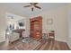 Living room with hardwood floors, comfy seating, and built-in shelving at 179 Andada Dr, Henderson, NV 89012