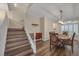 Elegant staircase with white railings and wood flooring at 179 Andada Dr, Henderson, NV 89012