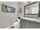 Modern bathroom with single vanity and toilet at 22 Arborfield Ct, Henderson, NV 89012