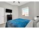 Guest bedroom with a TV and dresser at 22 Arborfield Ct, Henderson, NV 89012