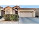 House exterior featuring a two-car garage at 22 Arborfield Ct, Henderson, NV 89012