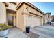 Home exterior with two-car garage and landscaping at 22 Arborfield Ct, Henderson, NV 89012