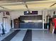 Organized garage with built-in cabinetry and overhead storage at 22 Arborfield Ct, Henderson, NV 89012