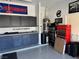 Garage with workbenches and storage cabinets at 22 Arborfield Ct, Henderson, NV 89012