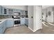 Modern kitchen with light blue cabinets and stainless steel appliances at 22 Arborfield Ct, Henderson, NV 89012