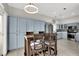 Modern kitchen with stainless steel appliances and light blue cabinets at 22 Arborfield Ct, Henderson, NV 89012