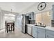 Bright kitchen with stainless steel appliances and light blue cabinets at 22 Arborfield Ct, Henderson, NV 89012