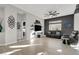 Spacious living room with leather couches and hardwood floors at 22 Arborfield Ct, Henderson, NV 89012