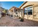 Covered patio with seating area in backyard at 22 Arborfield Ct, Henderson, NV 89012