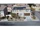 Two-story house with solar panels, driveway, and landscaping, in a residential neighborhood at 2404 Briggsdale Ave, North Las Vegas, NV 89081