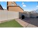 Small backyard with patio, artificial turf, and grill at 2404 Briggsdale Ave, North Las Vegas, NV 89081